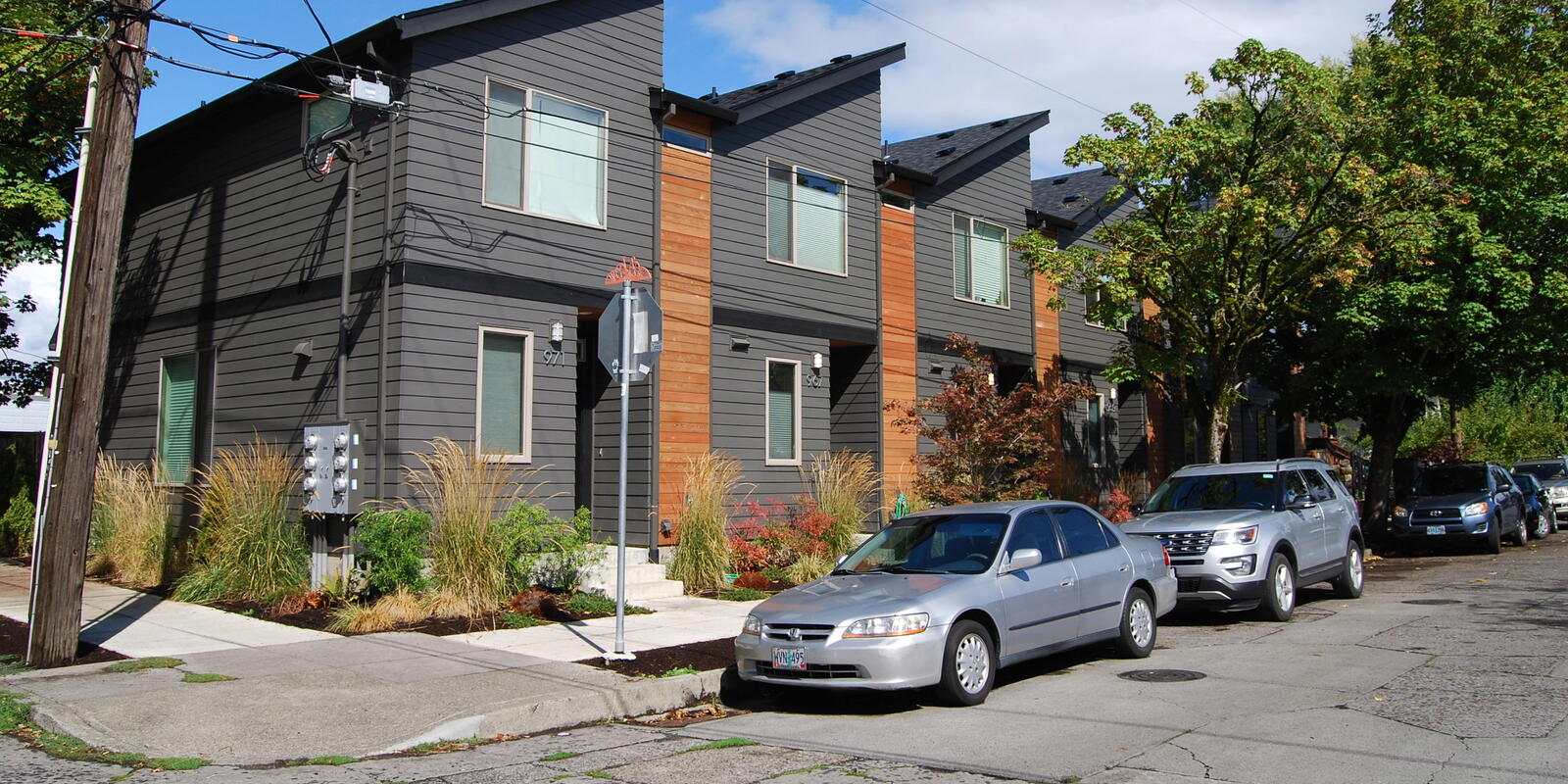 A gray sixplex building